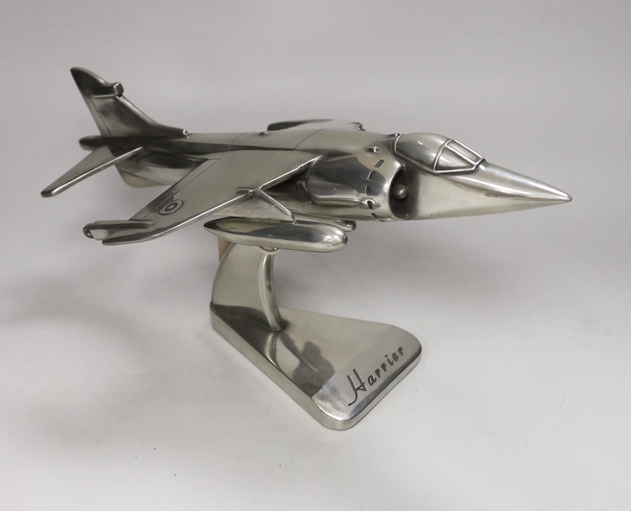 An aluminium Harrier jet model, 42cm long